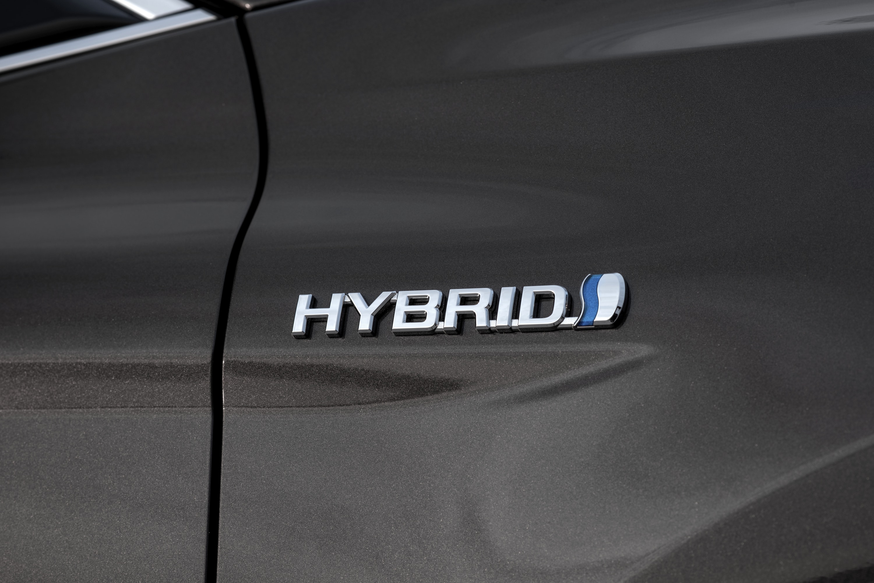 Close up of the Toyota Camry Hybrid badge